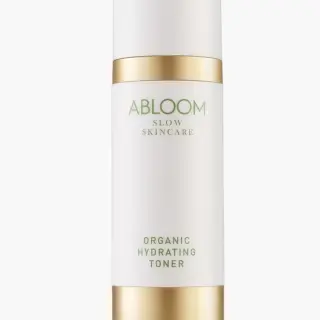 Abloom Organic Hydrating Toner bottle with gold accents on white background.