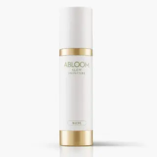 White and gold Abloom Slow Skincare bottle labelled "Nude".