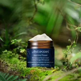 Antipodes Jasmine Flower Menopause Facial Cream in a forest setting.