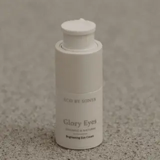 Eco by Sonya Glory Eyes Brightening Eye Cream on speckled surface.