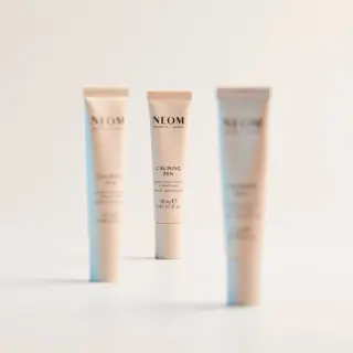 Three NEOM Calming Pen tubes on a white background.