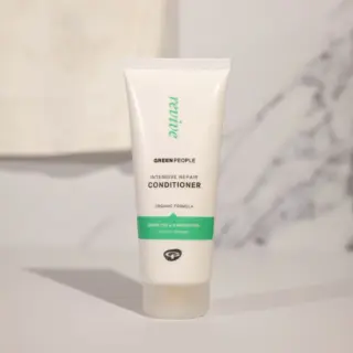 Green People Intensive Repair Conditioner tube on a light background.