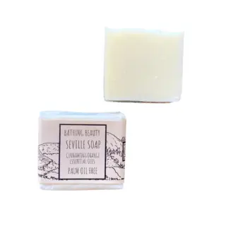 Two bars of Seville soap, one wrapped, one unwrapped. Label reads: "Palm oil free".