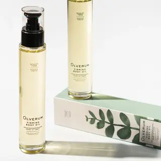 Olverum Firming Body Oil bottles with packaging featuring green leaf design.