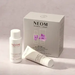 NEOM Better Sleep Duo set with bath milk and body butter on a light surface.