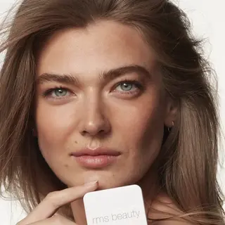 Person holding rms beauty product, text "BEACHWALK BETTY" in corner.