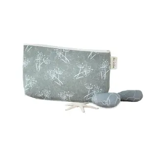 Grey pouch with white floral pattern, two grey stones, and a small starfish.