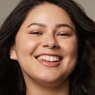 Smiling person with clear skin, dark hair, and text "BUFF" in the corner.