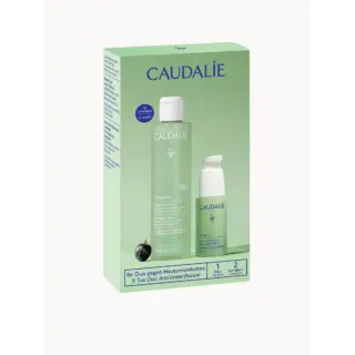 Caudalie Vinopure skincare set with purifying toner and serum in green packaging.