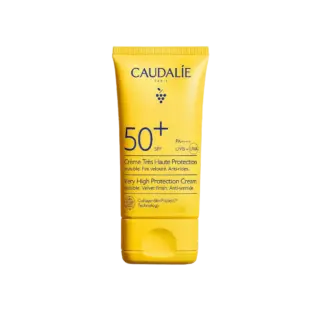 Yellow tube of Caudalie SPF 50+ sun cream with anti-wrinkle protection.