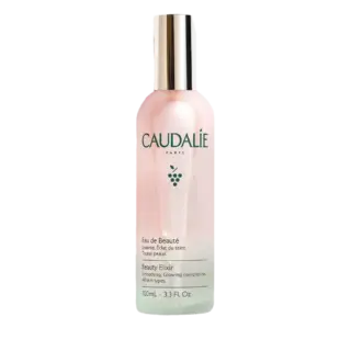 Caudalie Beauty Elixir bottle, 100ml, with silver cap and grape logo.