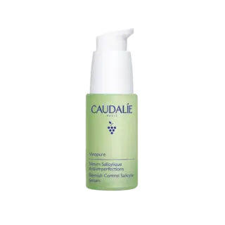 Caudalie Vinopure Blemish Control Salicylic Serum in a green pump bottle.