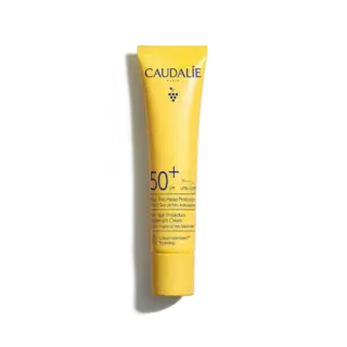 Yellow tube of Caudalie SPF 50+ sunscreen with antioxidant protection.