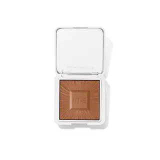 Open compact with brown powder and "rms" embossed, white case.