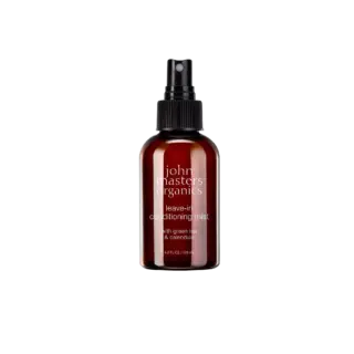 Brown spray bottle labelled "john masters organics leave-in conditioning mist".