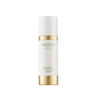 Abloom Slow Skincare Organic Hydrating Toner in a white and gold bottle.
