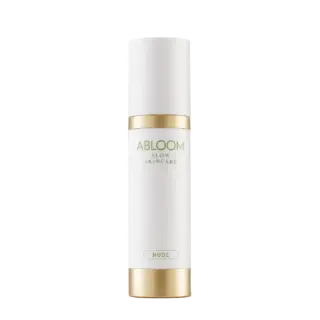 White bottle with gold accents, labelled "Abloom Slow Skincare Nude".