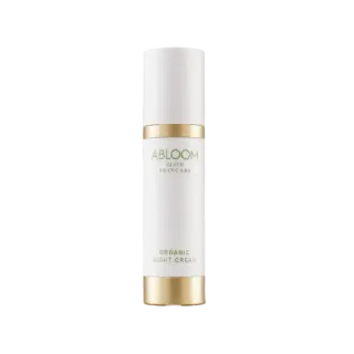 White bottle of Abloom Organic Night Cream with gold accents.