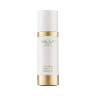 Abloom Slow Skincare Organic Purifying Cleanser in a white and gold bottle.