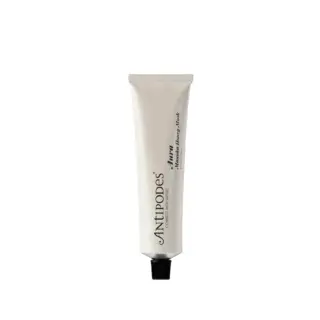 Antipodes Aura Manuka Honey Mask tube with black cap on white background.
