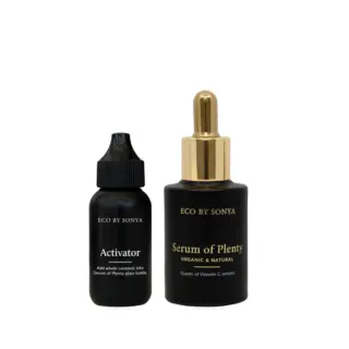 Two black bottles of Eco by Sonya skincare products, labelled Activator and Serum of Plenty.