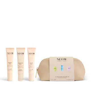NEOM Wellbeing Pen Discovery Set with three tubes and a beige pouch.