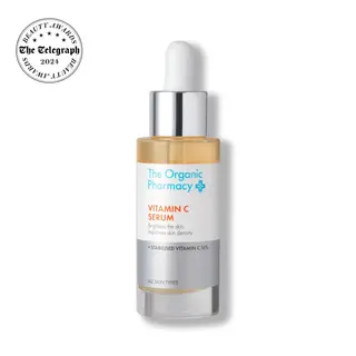 The Organic Pharmacy Vitamin C Serum bottle with dropper and award badge.