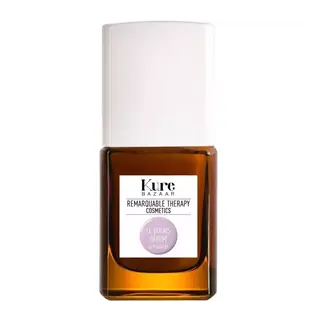 Brown bottle with white cap, labelled "Kure Bazaar Remarkable Therapy Cosmetics Le Vernis Sérum".