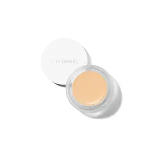Open jar of beige cream with "rms beauty" on the white lid.