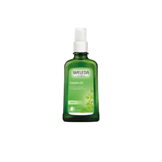 Green bottle of Weleda Birch Cellulite Oil with white pump dispenser.
