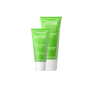 Two green tubes of Weleda Skin Food Light moisturising skincare.