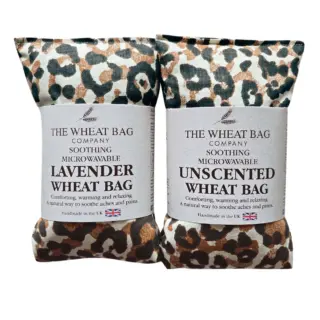 Two leopard print wheat bags, one lavender, one unscented, labelled for soothing and microwavable use.
