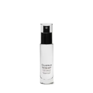 Clear bottle of Olverum Restful Sleep Pillow Mist with black spray top.