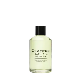 Clear bottle of Olverum bath oil with black cap.