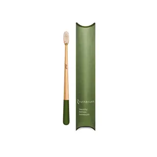 Bamboo toothbrush with green handle and matching green packaging.