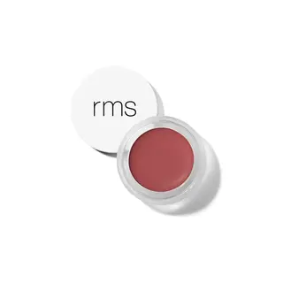 Open pot of red cream with white lid displaying "rms" text.