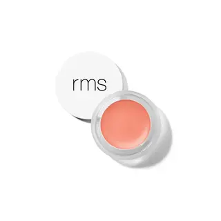 Open jar of peach-coloured cream with "rms" on the white lid.
