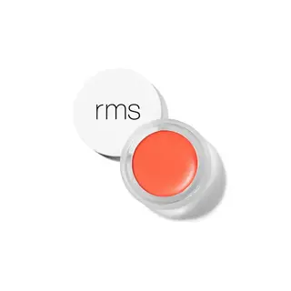 Open jar of orange lip balm with "rms" on the white lid.
