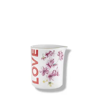 White mug with "LOVE" in red and pink floral design.