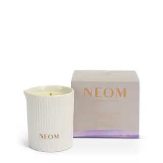 NEOM candle in a ribbed white holder with matching box.