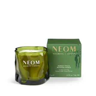 Green NEOM candle and box, labelled "Perfect Peace Scented Candle".