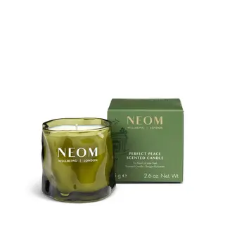 Green NEOM candle and box, labelled "Perfect Peace Scented Candle".