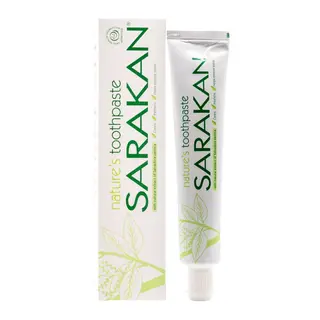 Sarakan toothpaste tube and box with green leaf design and text.