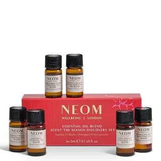 NEOM essential oil set with six bottles and red box.