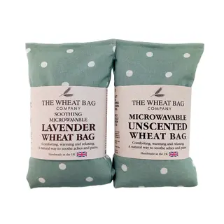 Two green polka dot wheat bags, lavender and unscented, by The Wheat Bag Company.