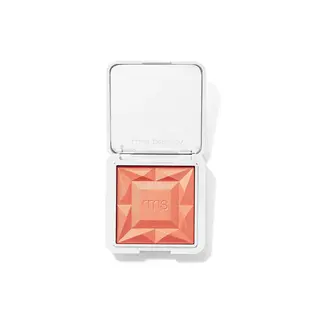 Open compact with peach blush, geometric pattern, and "rms" embossed on the surface.