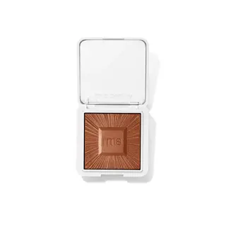 Open compact with bronze powder, "rms beauty" embossed on lid and powder.