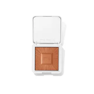 Open compact with bronze powder, "rms beauty" embossed on lid and powder.