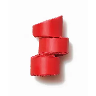 Three stacked red lipstick slices on a white background.