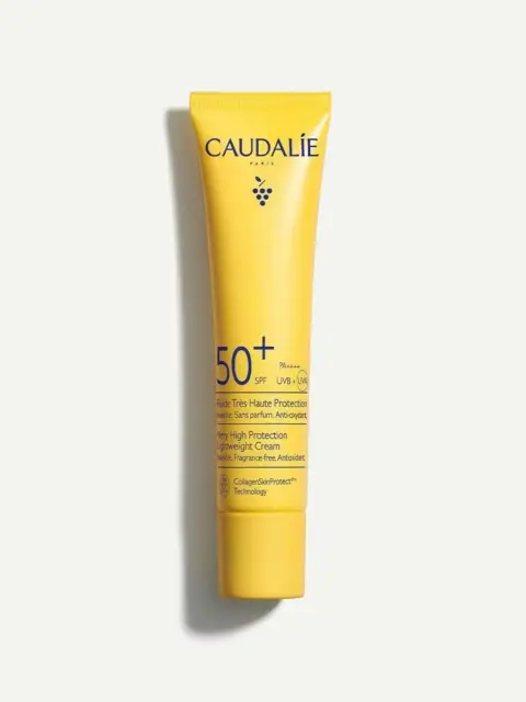 Yellow tube of Caudalie SPF 50+ sunscreen with UVA/UVB protection.